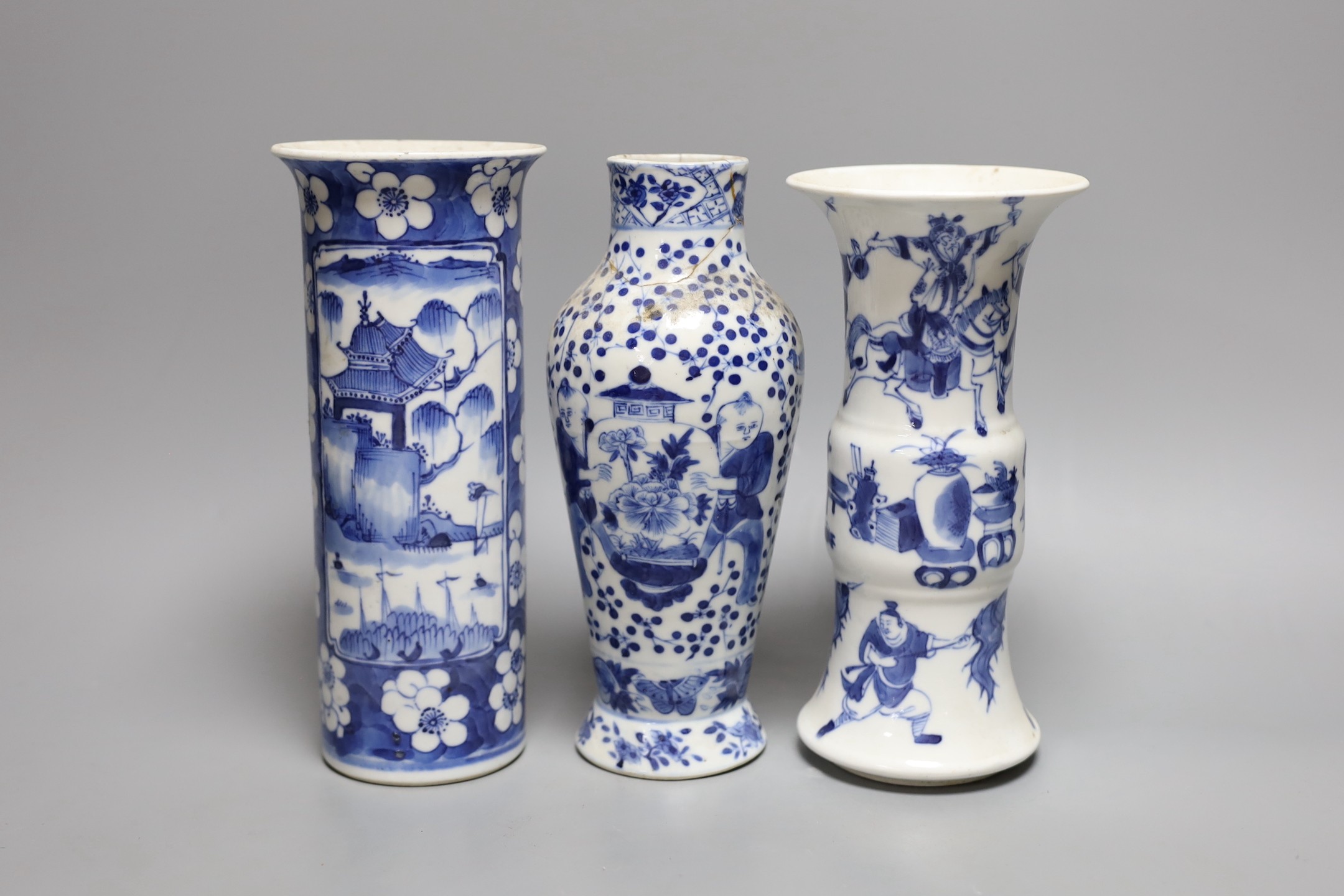 A Chinese blue and white sleeve vase and two other similar vases, late Qing dynasty, tallest 21 cms high